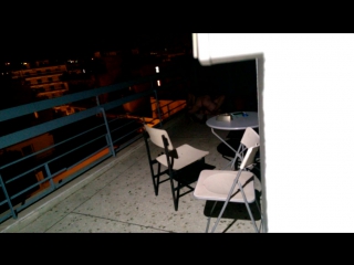 a couple from a nearby hotel room fucks on the balcony